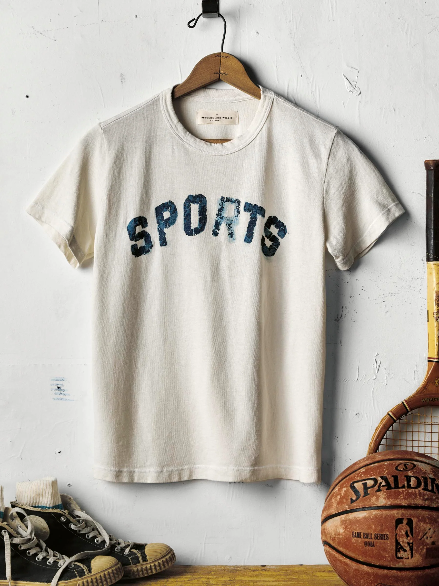 the "sports" tee